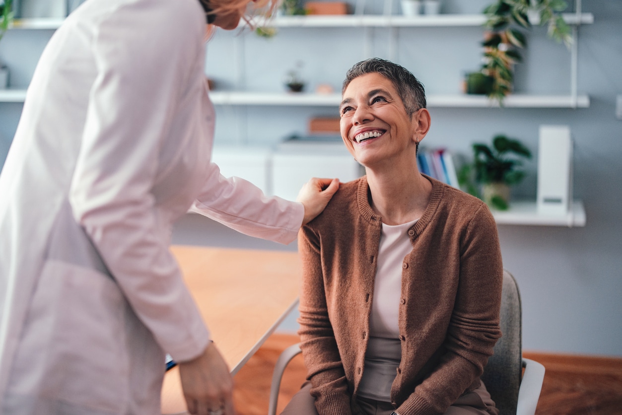 Doctor Consoling Patient in Bright Clinic Interior During Inspirational Consultation